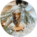 an ice coffee in a tall glass